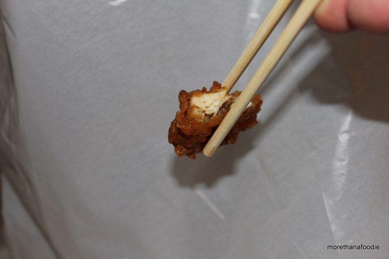bon chon chicken on a chopstick